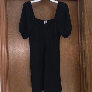 Black skater dress with bubble sleeves.